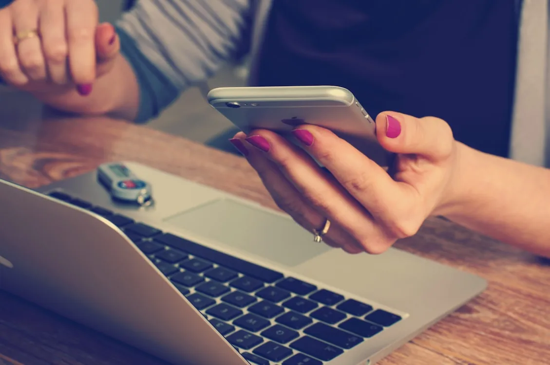 Hospitality business owner on a phone call in a café setting
